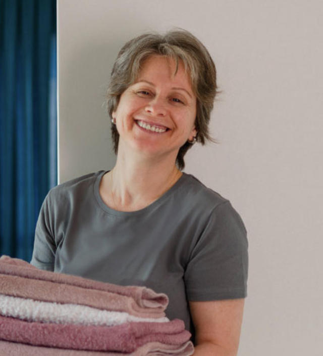 Woman with cleaning supplies